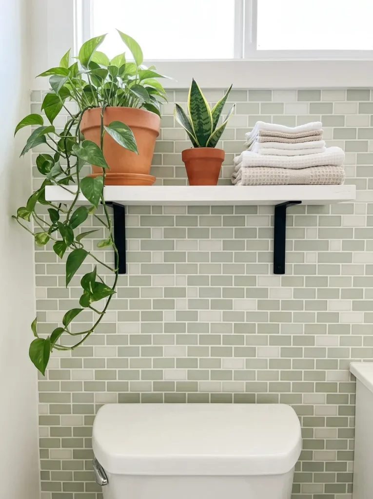 27 Guest Bathroom Ideas That Leave Visitors Pampered 5 Painted Greenery Shelf